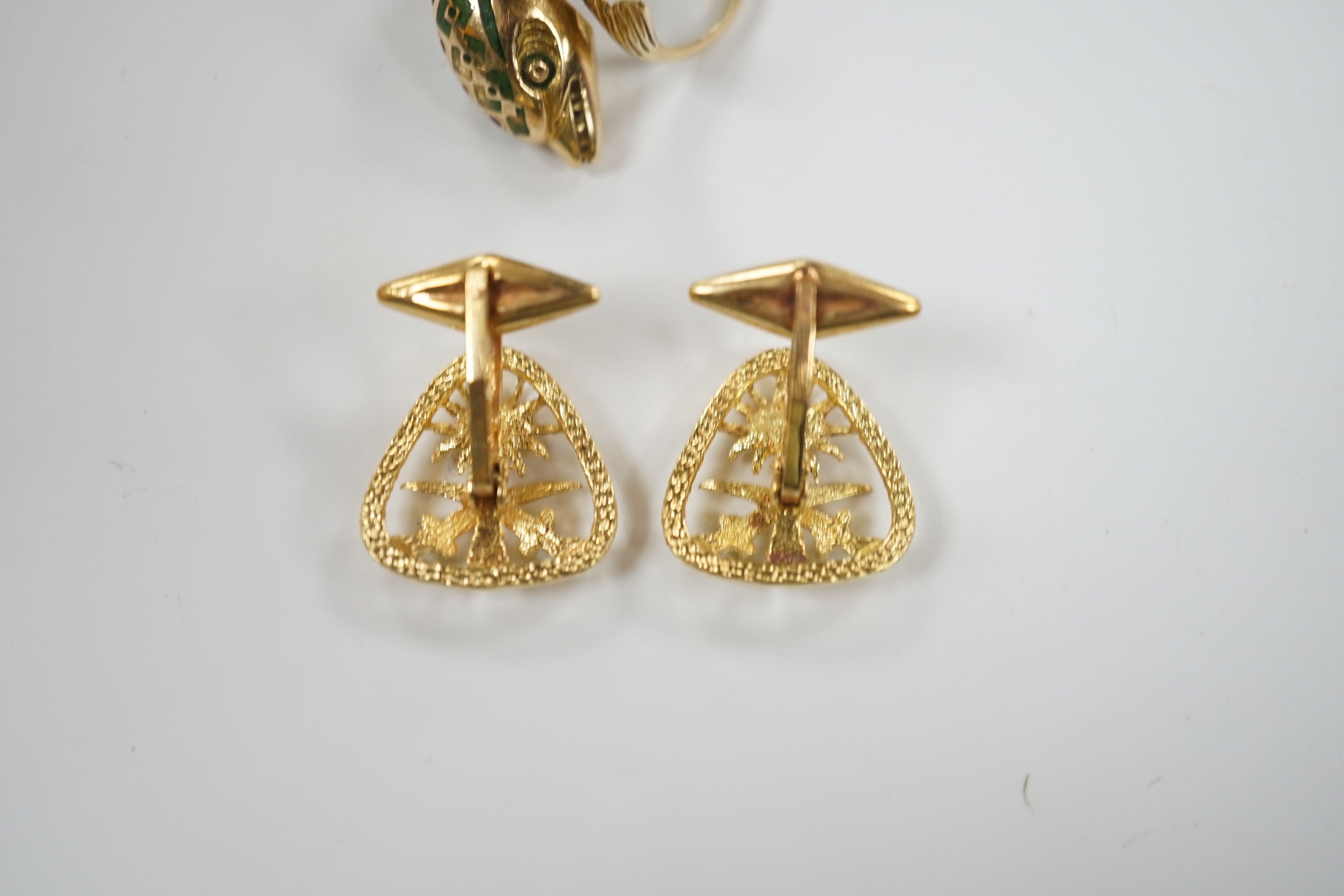 A continental 18k and two colour enamel dolphin ring, size N and a pair of 750 yellow metal Middle Eastern cufflinks